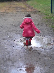 jumping in muddy puddles